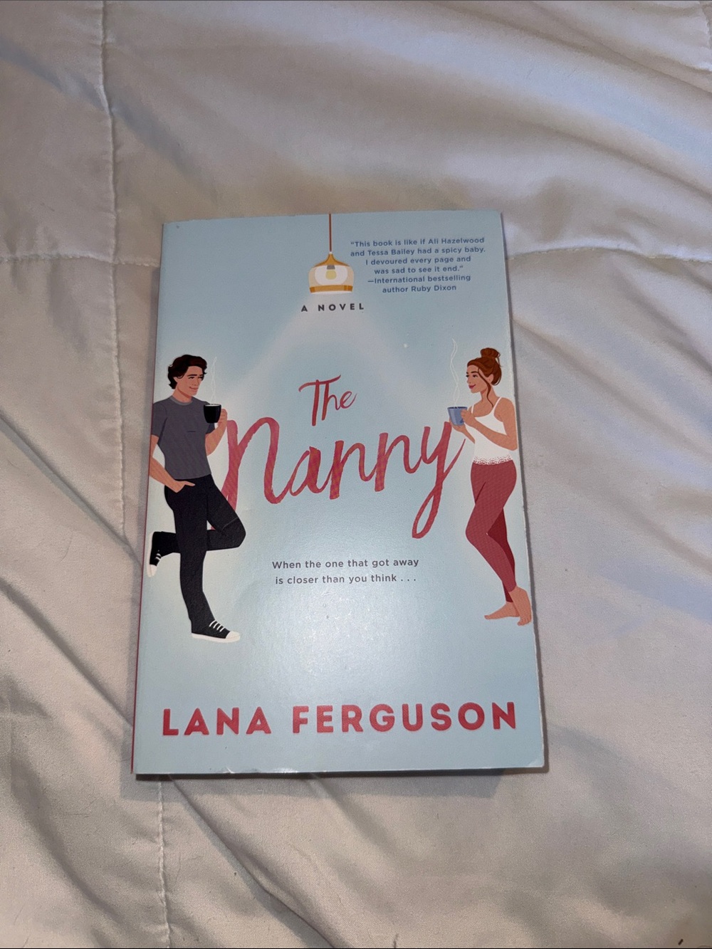 The Nanny by Lana Ferguson - Light Blue & Pink Paperback Novel